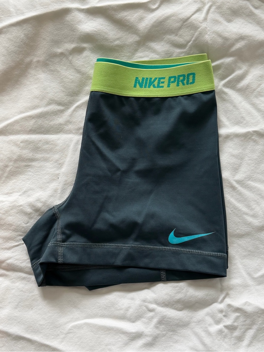 Nike Pro Black Athletic Shorts with Lime Green Waistband and Teal Swoosh